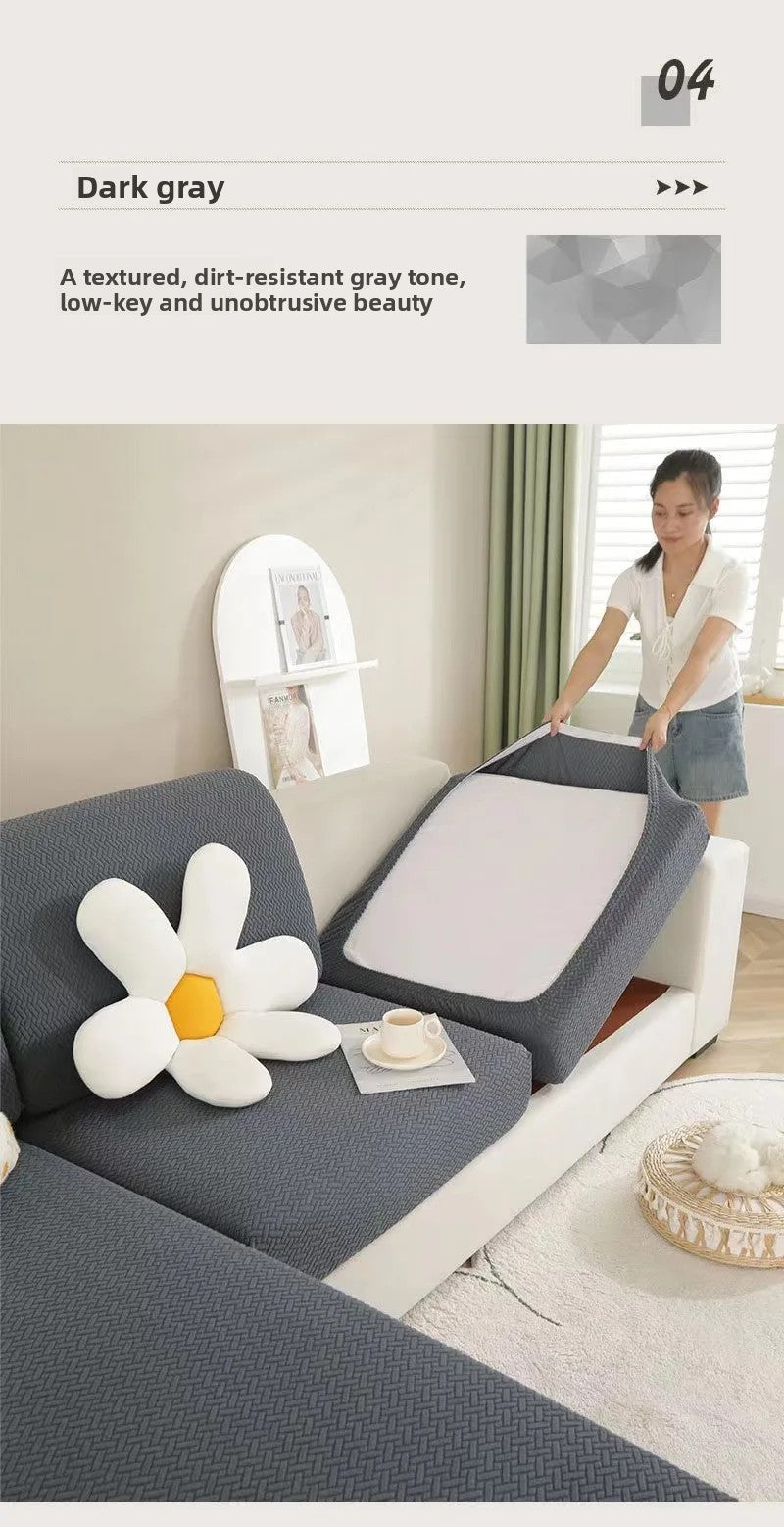 A dark gray sofa seat protector cushion cover is shown on a white sofa, with a woman standing nearby.