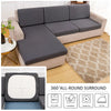 A gray sofa cushion protector cover shown with washing instructions for 30°C, hand wash, tumble dry, and iron.