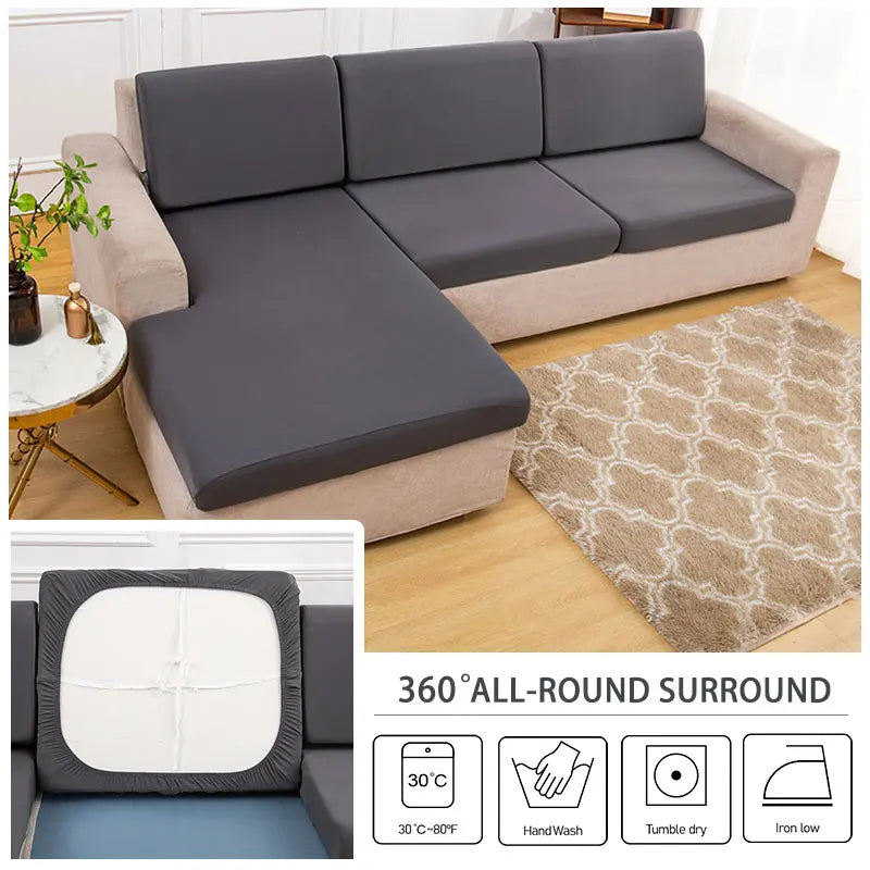 A gray sofa cushion protector cover shown with washing instructions for 30°C, hand wash, tumble dry, and iron.