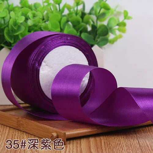 Roll of 4 cm wide purple satin ribbon for gift wrapping and DIY crafts