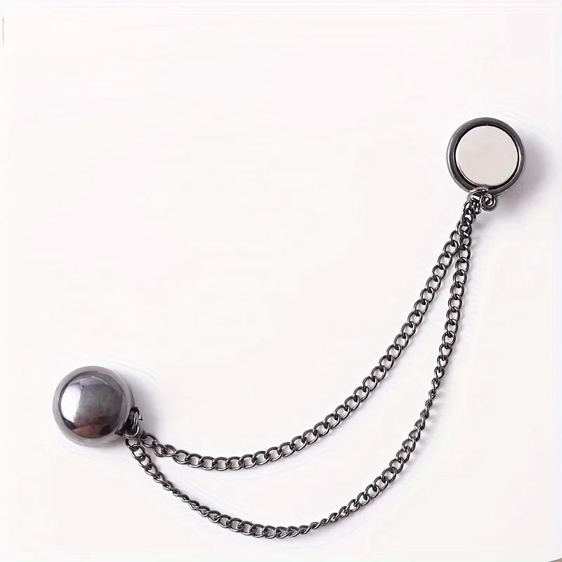 Silver adjustable hem t-shirt shortener with a chain and circular disc.