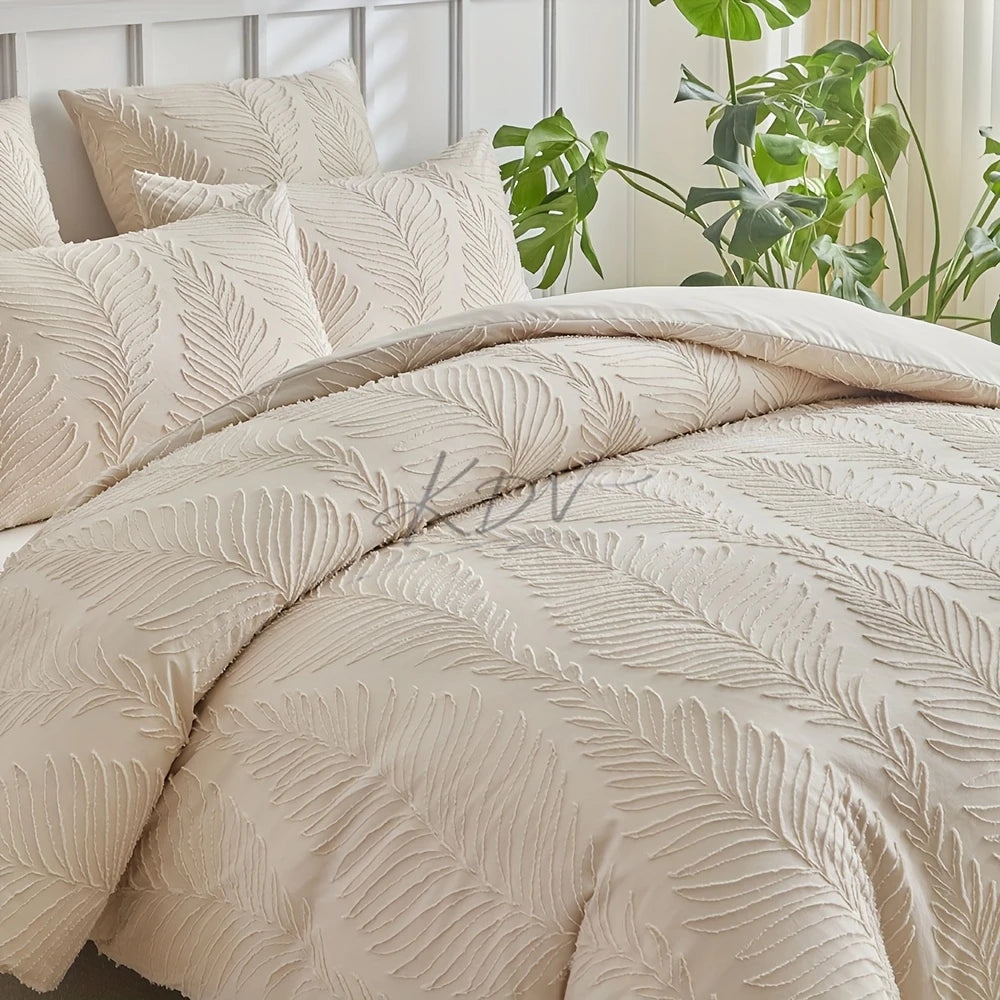 A beige embossed leaf duvet cover set displayed on a bed with green foliage in the background.