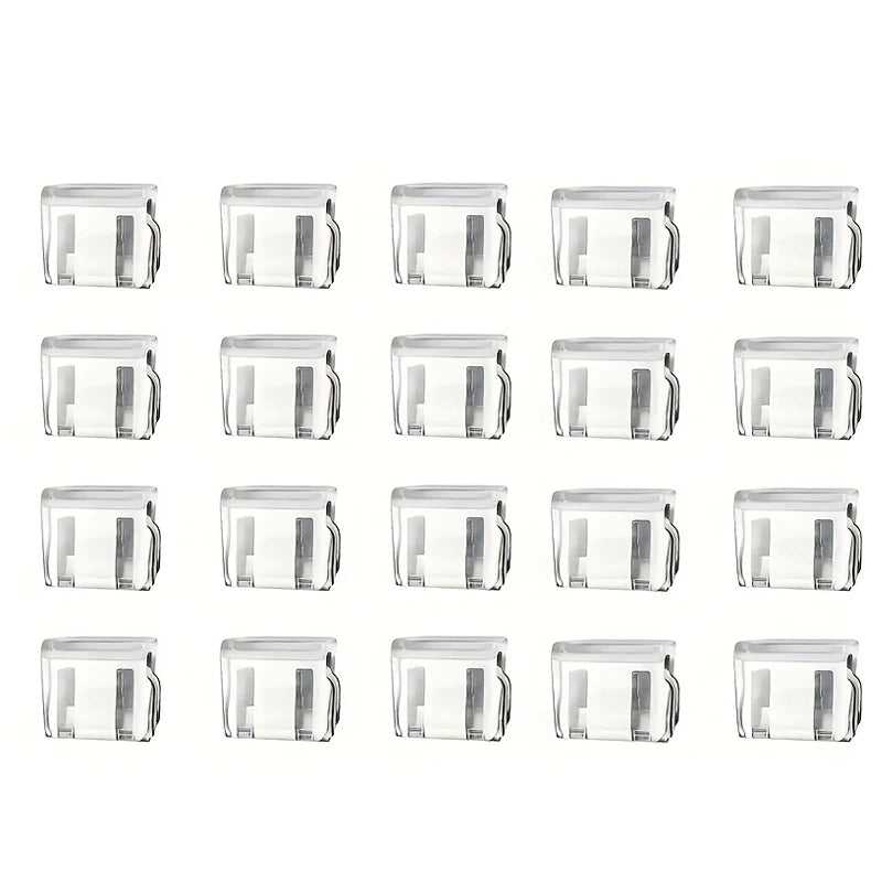 A set of twelve clear plastic invisible edge clips for adjusting pants hems.