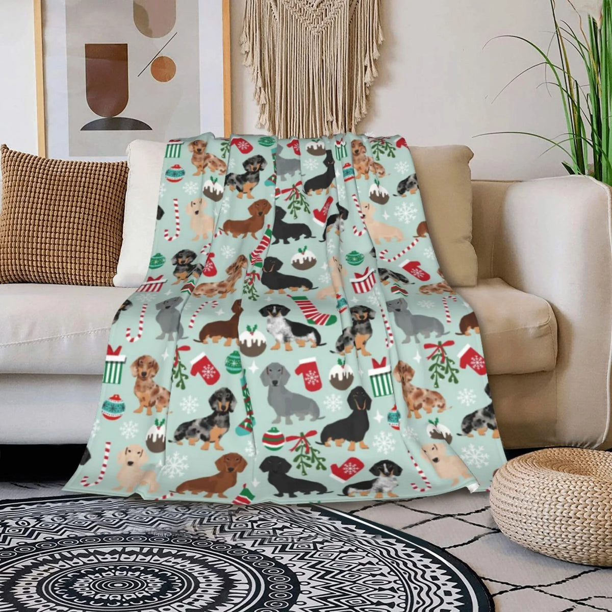 A light mint green flannel blanket featuring a pattern of various dog breeds in autumnal colors and festive accents.
