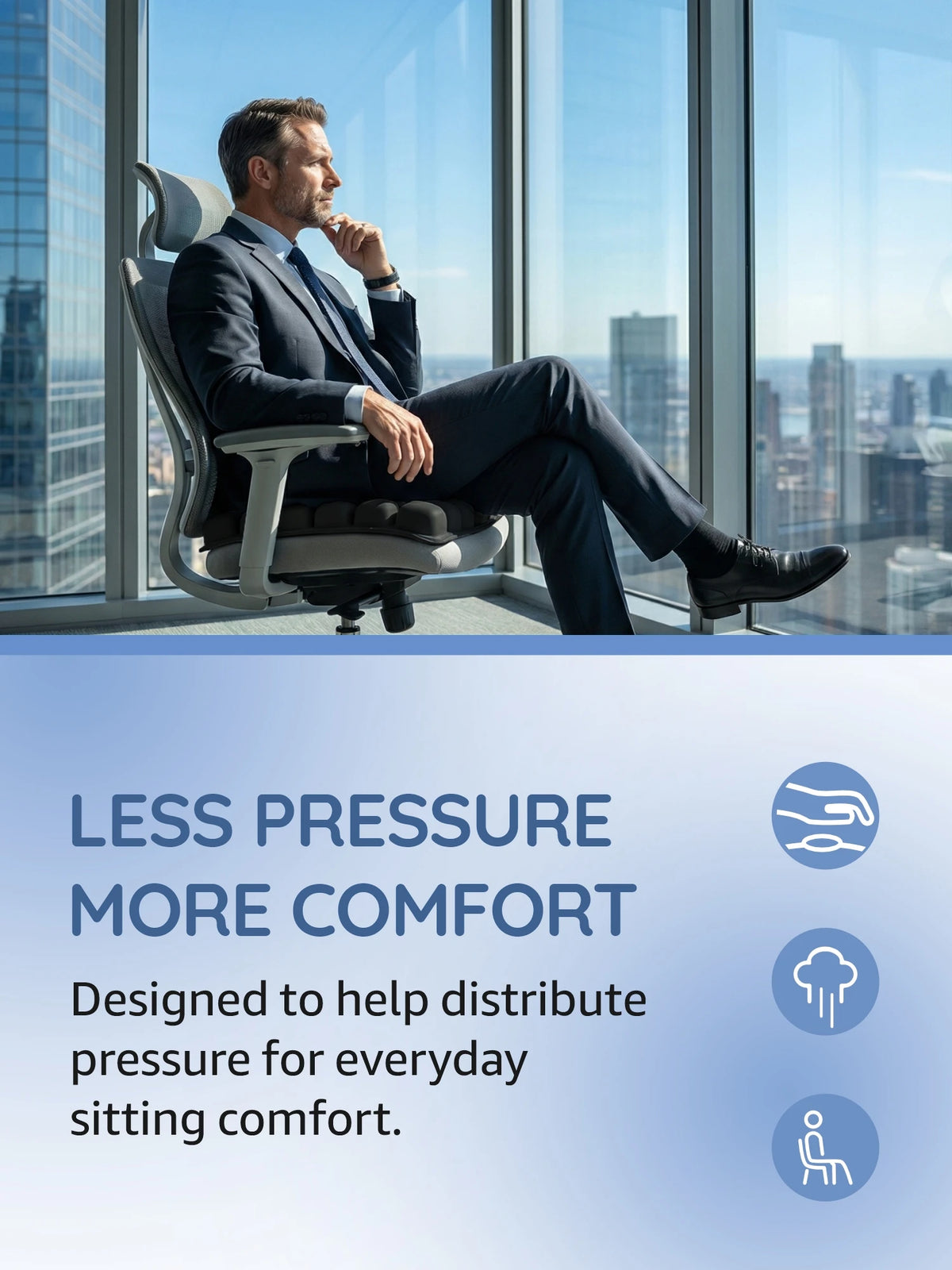 A man sits in an ergonomic chair with a seat cushion, demonstrating the comfort of a less pressure design.