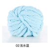 A ball of light blue hand-woven chunky chenille yarn.