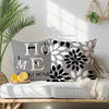 A gray and black geometric print square pillowcase cover displayed on a white surface with natural light.