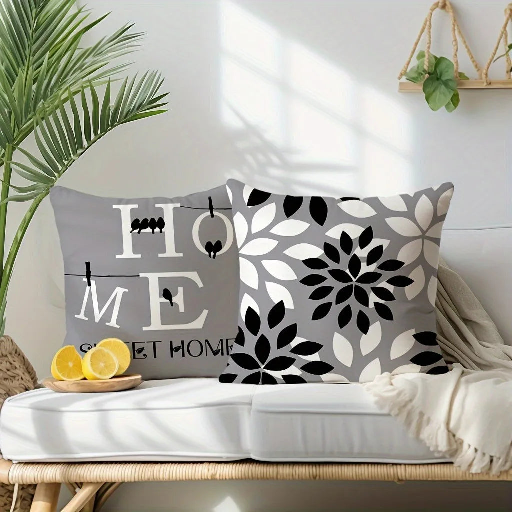 A gray and black geometric print square pillowcase cover displayed on a white surface with natural light.