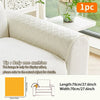 A beige quilted sofa cushion displayed on a white sofa, showing its dimensions.