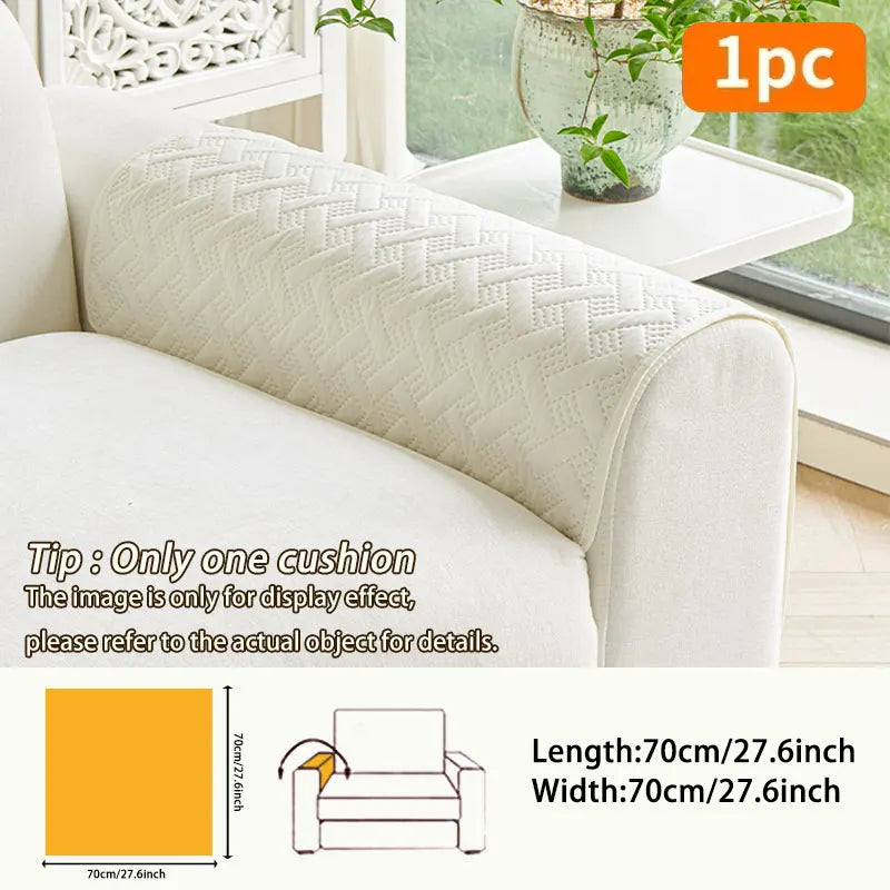 A beige quilted sofa cushion displayed on a white sofa, showing its dimensions.