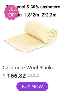 A rolled cashmere wool blanket in a pale yellow color displayed for sale.