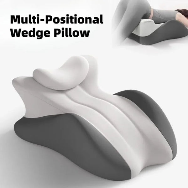 A multi-positional wedge pillow in gray and white, shown from a side view.