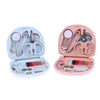 A pink portable DIY sewing box containing various sewing tools and needles for home crafts.
