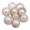 A cluster of pearl and crystal rhinestone sew-on buttons arranged in a sunflower pattern.