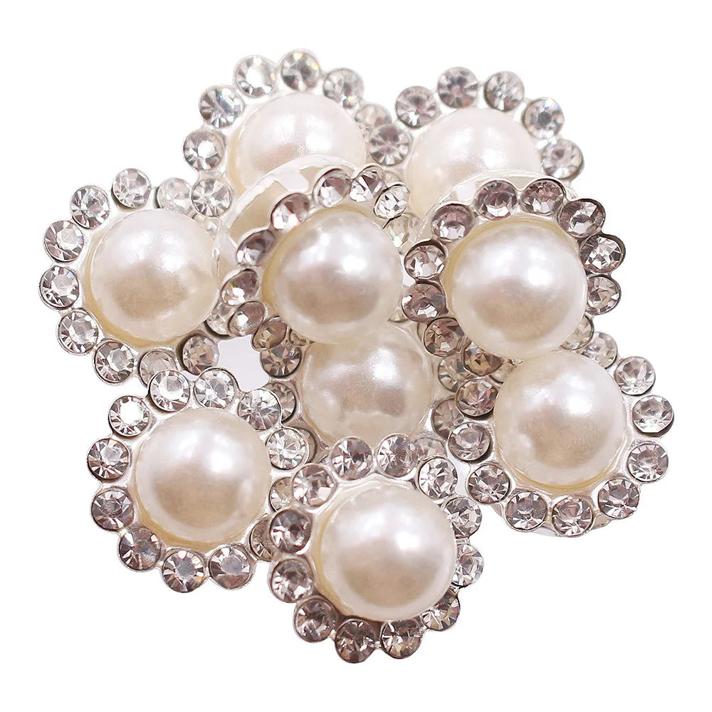 A cluster of pearl and crystal rhinestone sew-on buttons arranged in a sunflower pattern.