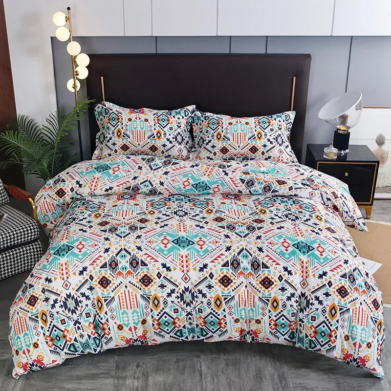 A patterned duvet cover set featuring geometric bohemian designs in white, teal, and orange tones on a bed.