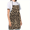 A woman wearing a sleeveless leopard print kitchen apron over a white t-shirt.