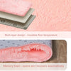 A cross-section view of a multi-layer pink plush carpet with a non-slip backing and memory foam layer.