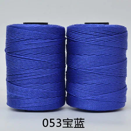 Blue hand knitting and crochet cord wound on spools