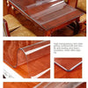 A close-up view of a durable transparent PVC table protector mat used for furniture protection.