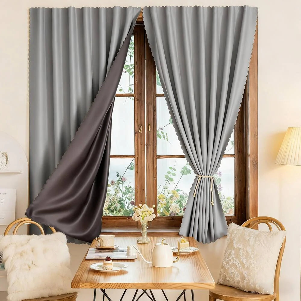 Gray self-adhesive blackout curtains with a hook and loop closure hanging in a wooden window frame.