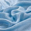 Light blue bamboo fiber cooling blanket fabric folded and draped