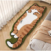 A decorative cat mat with an orange tabby pattern lying on a wooden floor next to a striped blanket.