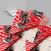 A pair of heavy-duty rolled hem foot for sewing machines displayed on a red and white checkered cloth.