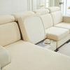 A light beige jacquard elastic sofa cushion slipcover on a modern sectional sofa.