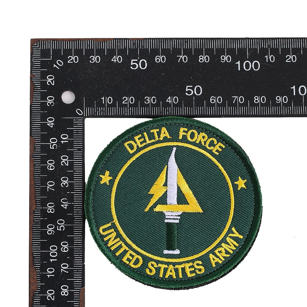 A round olive green embroidery patch featuring the text DELTA FORCE and UNITED STATES ARMY surrounded by stars.