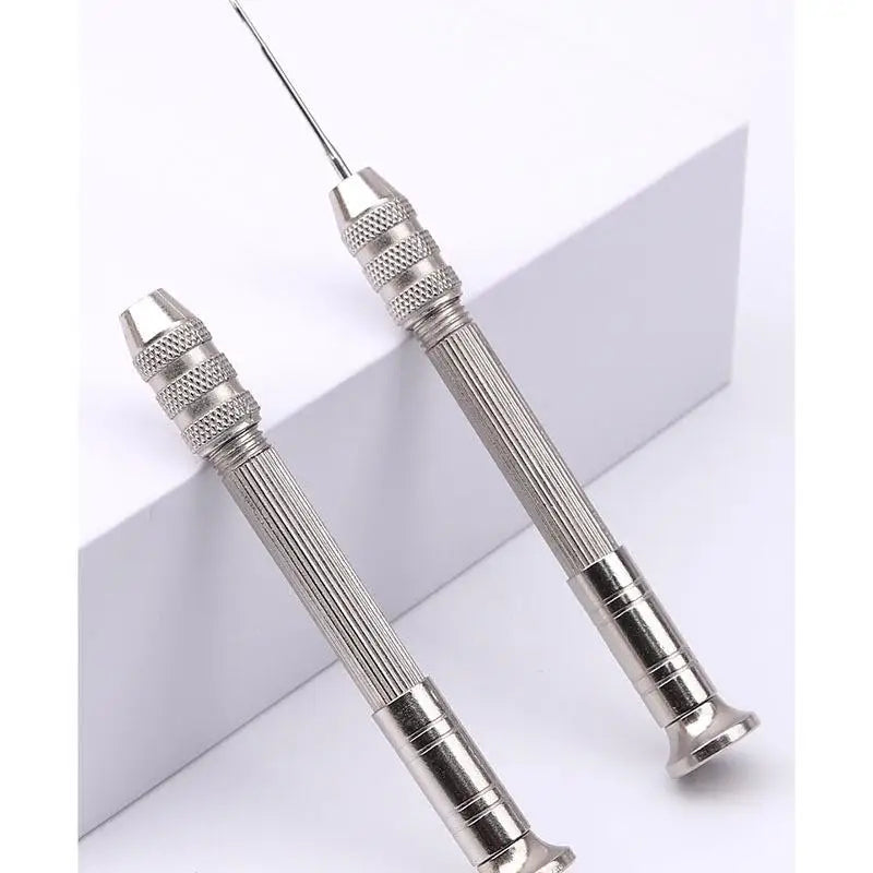 A pair of silver leather sewing awls and stitching tools shown against a white background.