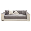 A light gray sofa with textured cushions and a white accent cushion.