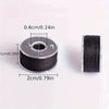 A roll of black thread with a diameter of 0.6cm and a length of 2cm is shown next to a spool.