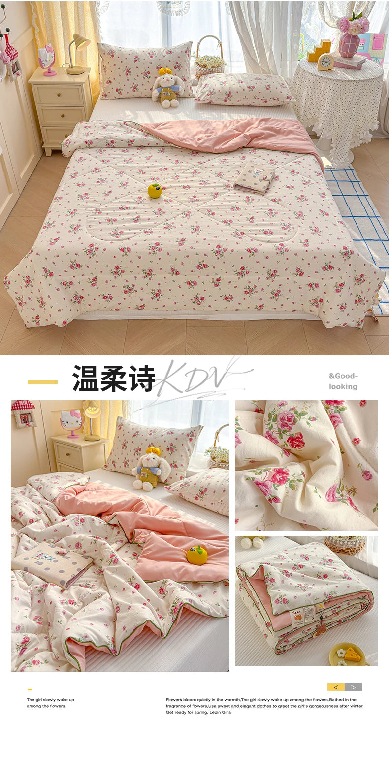 Pink floral quilt with yellow cartoon bears and roses displayed on a bed.