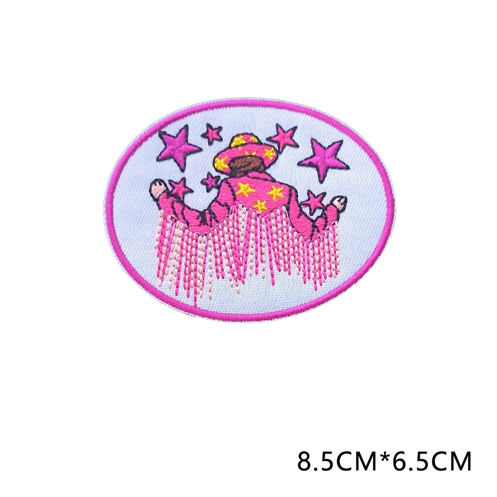Pink embroidered letter patch featuring a woman with a sombrero and stars