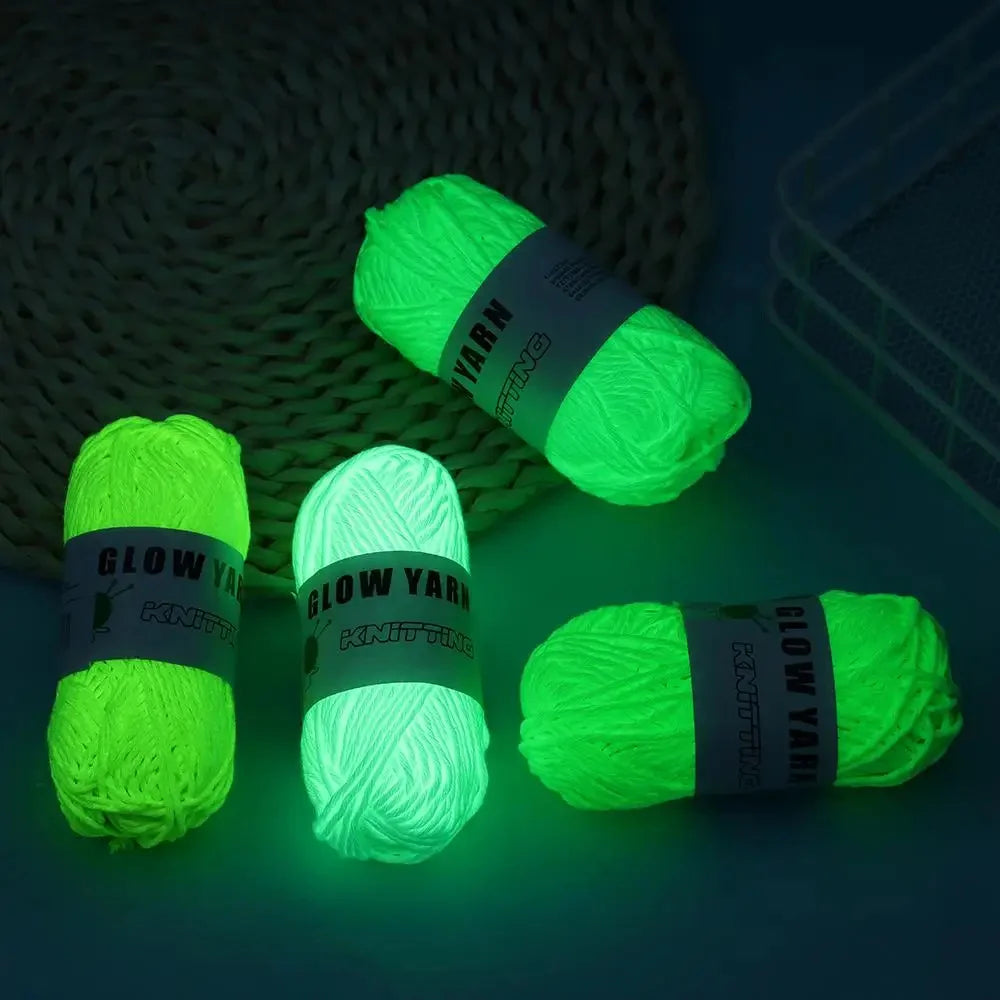 A bundle of luminous glow-in-the-dark yarn is shown on a dark surface.