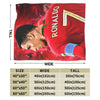 A red blanket featuring a graphic of a soccer player's face and the name RONALDO on it.