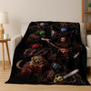 A dark flannel throw blanket featuring a pattern of horror characters and monsters.