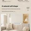 A beige sofa cover with a textured pattern and a cream pillow is shown in a bright interior setting.