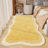 A rectangular yellow rug with light beige trim is placed on a wooden floor.