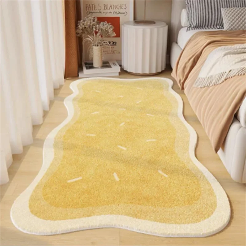 A rectangular yellow rug with light beige trim is placed on a wooden floor.