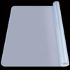A translucent silicone crafting mat with a cylindrical tool or guide resting beside it.