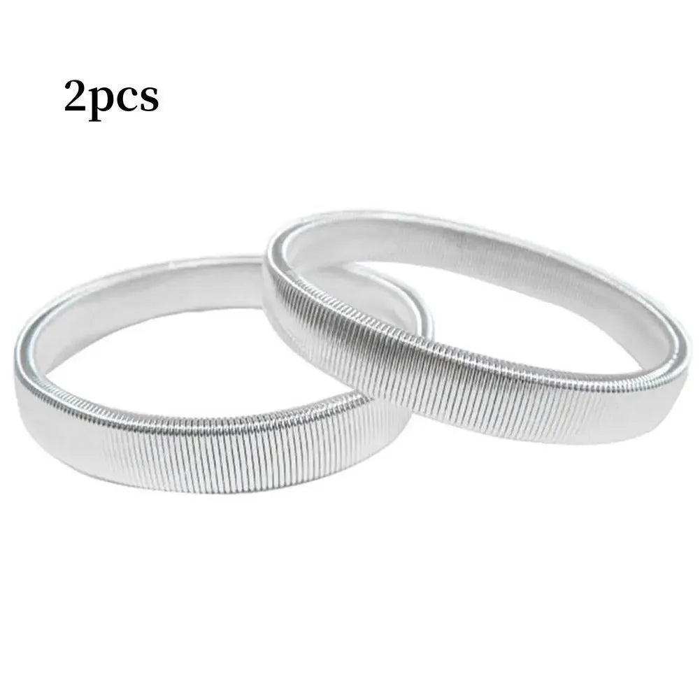 Two silver metal sleeve garters or adjustable arm bands for men
