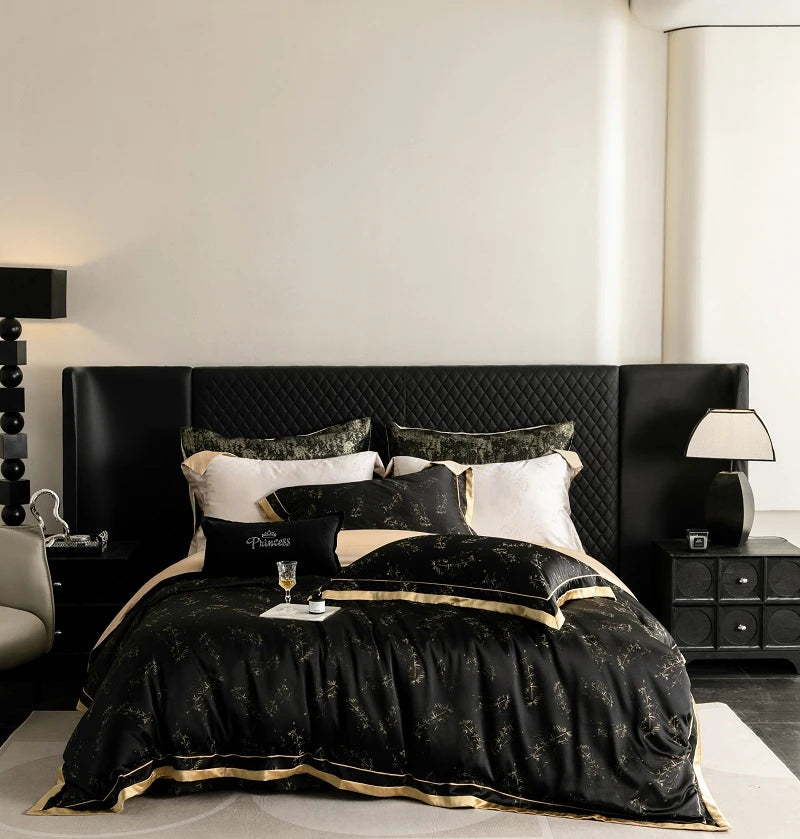A luxurious black and gold bedding set featuring a tufted headboard and white linens in a modern bedroom.