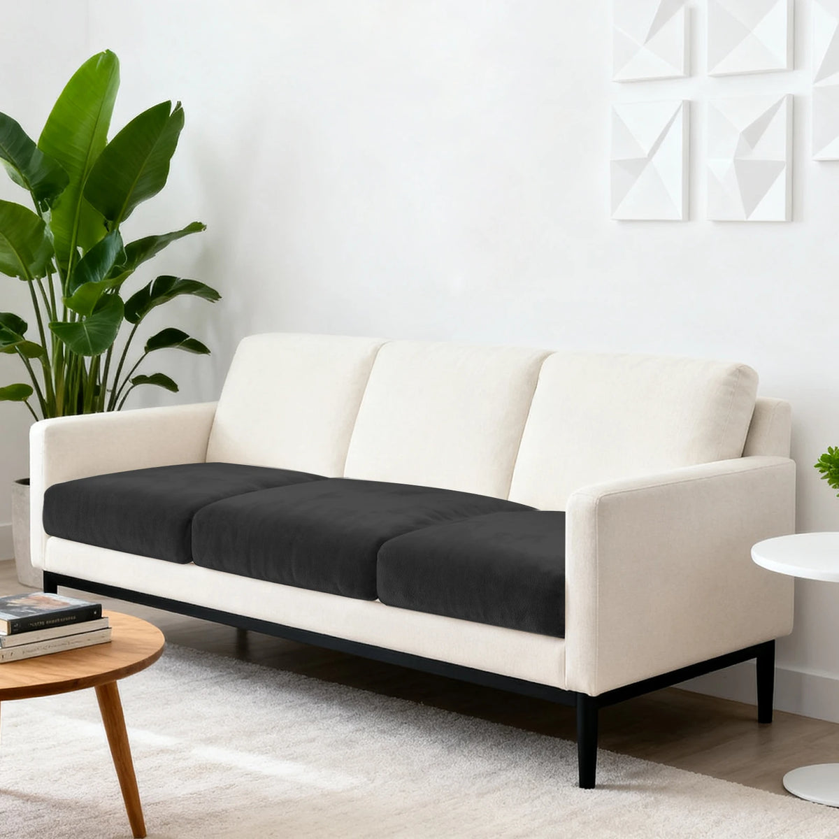 A cream-colored sofa features dark gray seat cushion covers with anti-slip elastic.