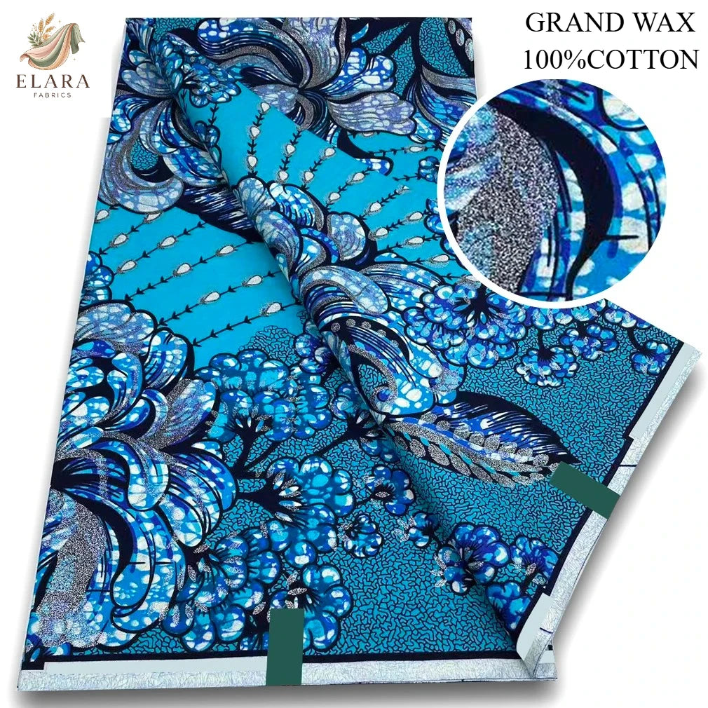 Blue and white African wax print fabric featuring intricate floral patterns