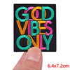 Black embroidered patch with colorful text that reads GOD VIBES ONLY