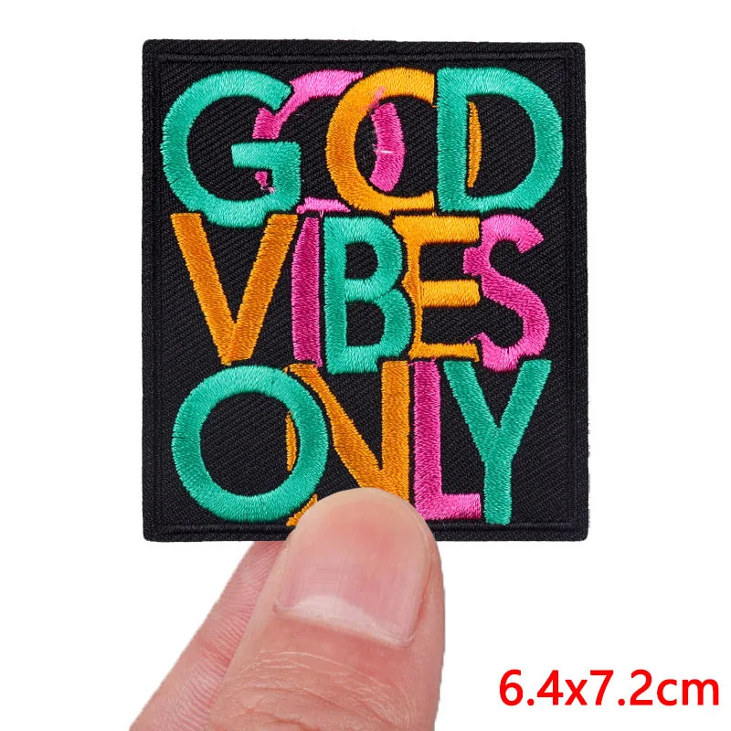 Black embroidered patch with colorful text that reads GOD VIBES ONLY
