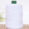 A roll of white crochet ice rope with a green cap, lying on a woven mat.
