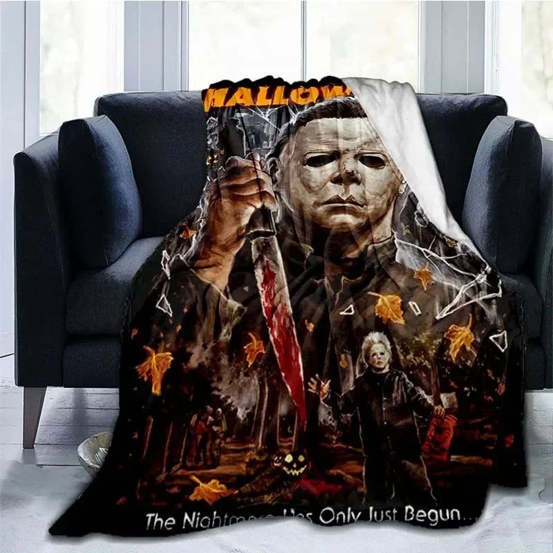 A dark horror themed throw blanket featuring a menacing figure resembling Michael Myers and autumn leaves.